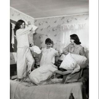 Four teenage girls having a pillow fight Poster Print (18 x 24)