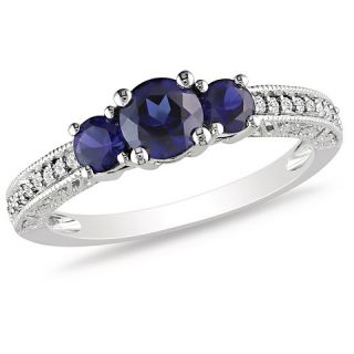 CT. T.W. Simulated Blue Sapphire and 1/8 CT. T.W. Diamond Ring in